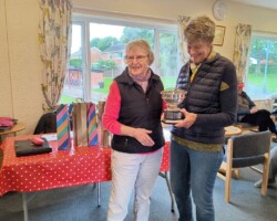 Ann presenting the trophy to Sue Ann presenting the trophy to Sue
