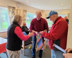 Ann presenting their prizes to Walter and John Ann presenting their prizes to Walter and John